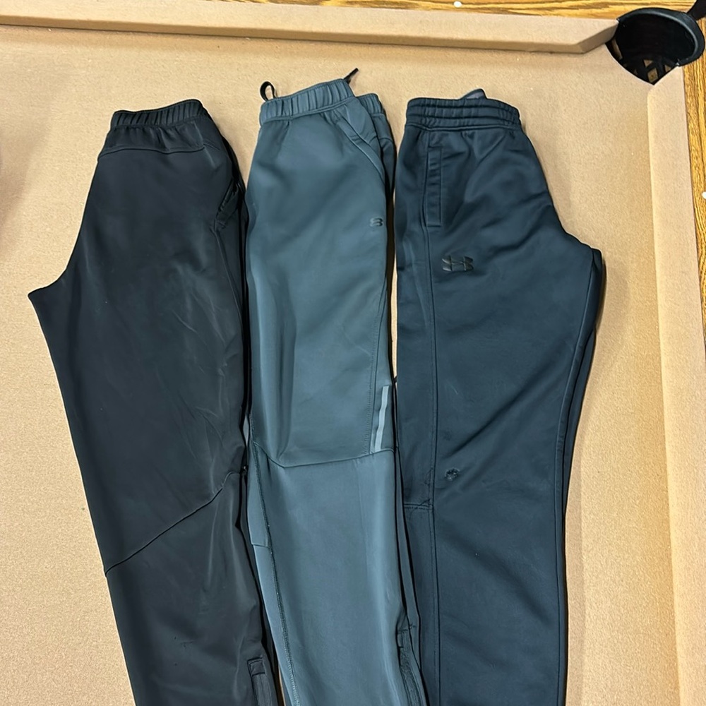 3pairs of Men’s size small pants. 2 black  and 1 dark gray.